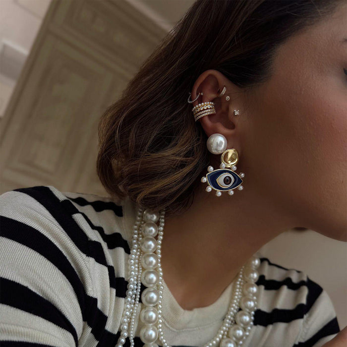 Wholesale Devil's Eye earrings have a niche, high-end, exaggerated personality, pearl earrings, and earrings