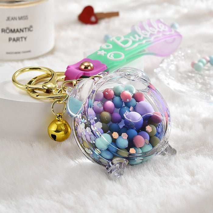Wholesale Acrylic oil bottle candy Bean astronaut keychain