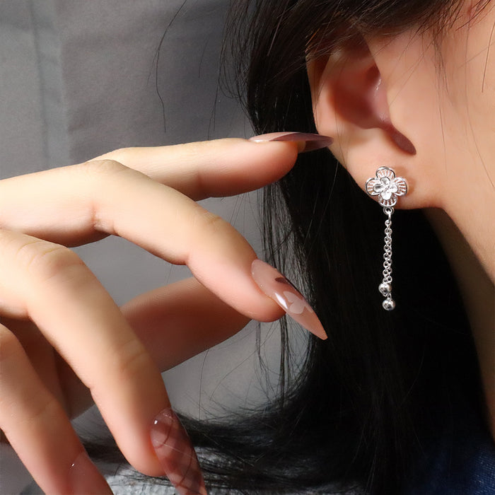 Wholesale Hollow flower tassel earrings, fashionable lucky clover earrings