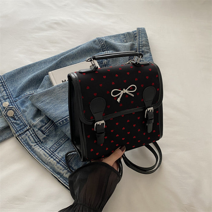 Wholesale Casual and fashionable handbag with heart-shaped printed canvas shoulders