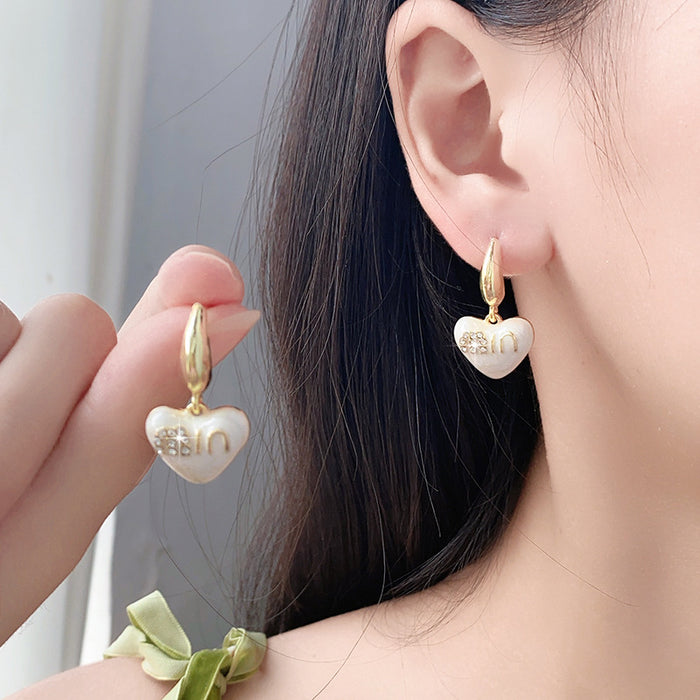Wholesale Love earrings, niche design, light luxury, high-end, silver needle earrings, temperament
