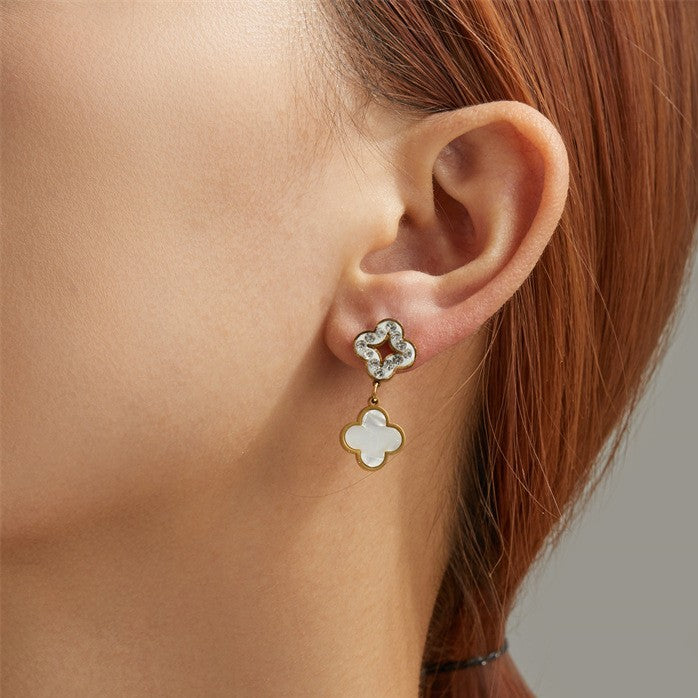 Wholesale Three four-leaf clover-shaped earrings with diamond embellishments.