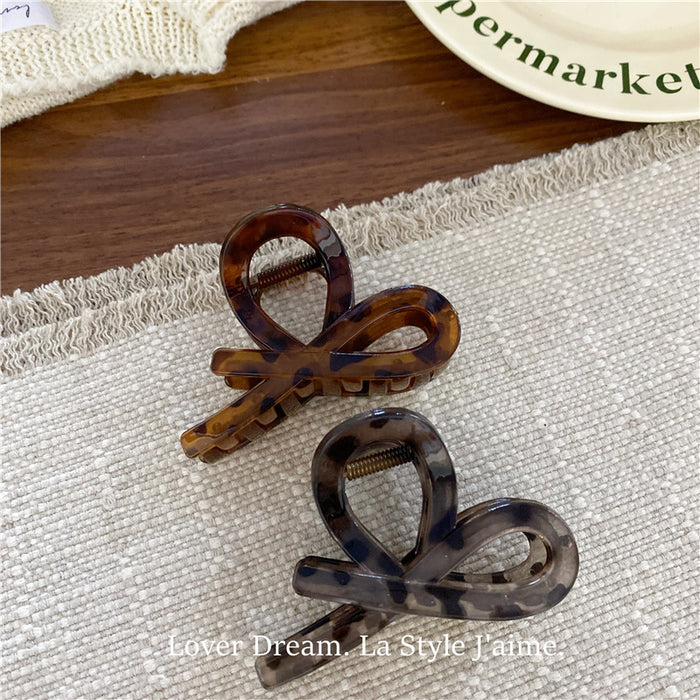 Wholesale Leopard print cross bow geometric hair clip, fashionable grip clip, versatile hair accessory