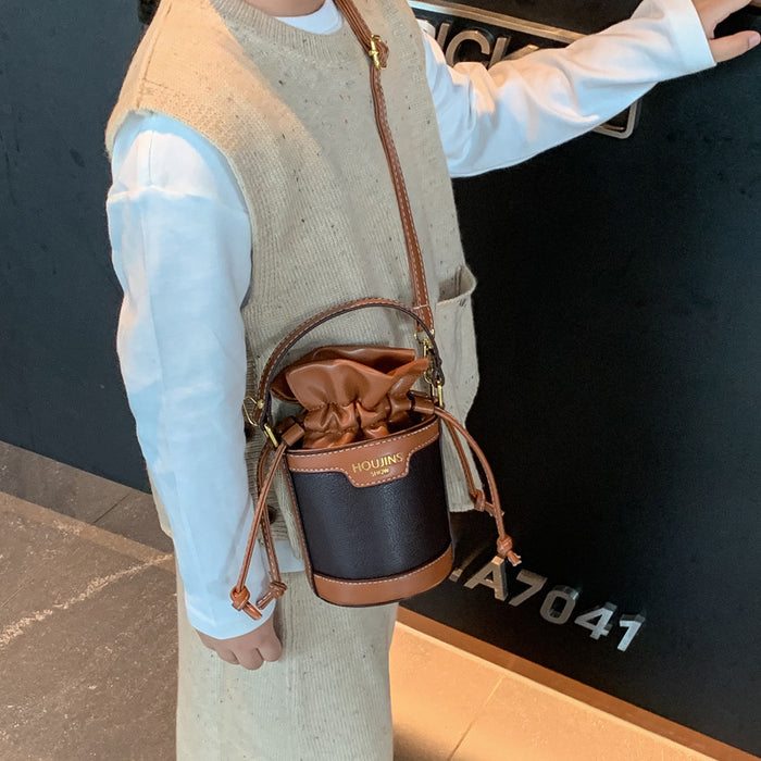 Wholesale Children's bag, contrasting color drawstring bucket bag, new retro crossbody bag for girls