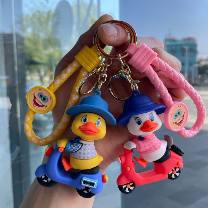 Wholesale Tram couple duck keychain couple backpack pendant claw machine doll car keychain exquisite small gift wholesale