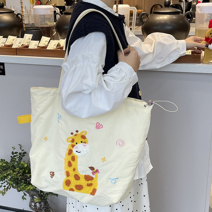 Wholesale Niche cartoon embroidered shoulder bag, simple and large capacity drawstring canvas bag, commuting tote bag for work