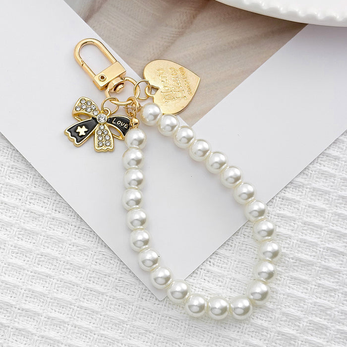 Wholesale Pearl chain beaded mobile phone lanyard bow pendant keychain
