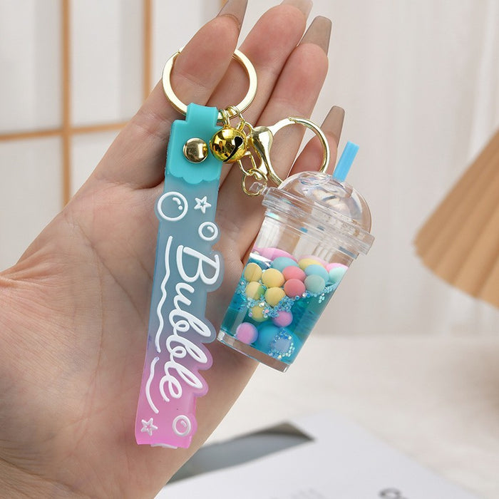 Wholesale Acrylic oil bottle candy Bean astronaut keychain