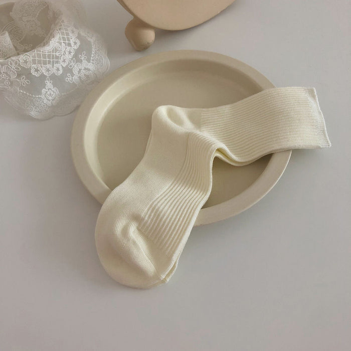 Wholesale Versatile thin strip pile socks, basic solid color mid tube socks