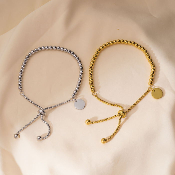 Wholesale Fashionable stainless steel bracelet with simple and fashionable circular hang tag, adjustable round bead, personalized pull-out bracelet
