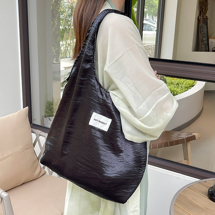 Wholesale Small niche design, environmentally friendly silver shoulder bag, large capacity leisure commuting shopping bag, handheld