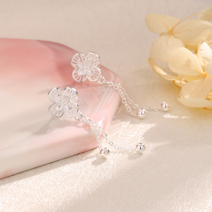 Wholesale Hollow flower tassel earrings, fashionable lucky clover earrings