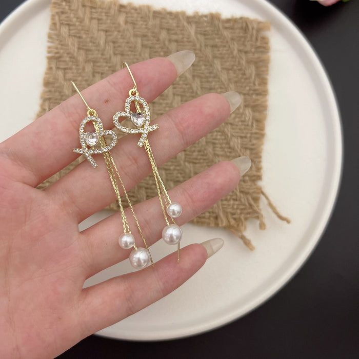 Wholesale Elegant and sparkling diamond studded heart-shaped tassel pearl ear line design, personalized and fashionable temperament, trendy ear accessories