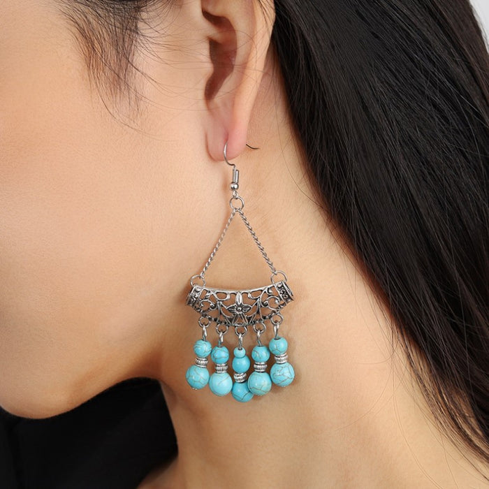 Wholesale Tassel earrings with hollowed out hidden silver earrings