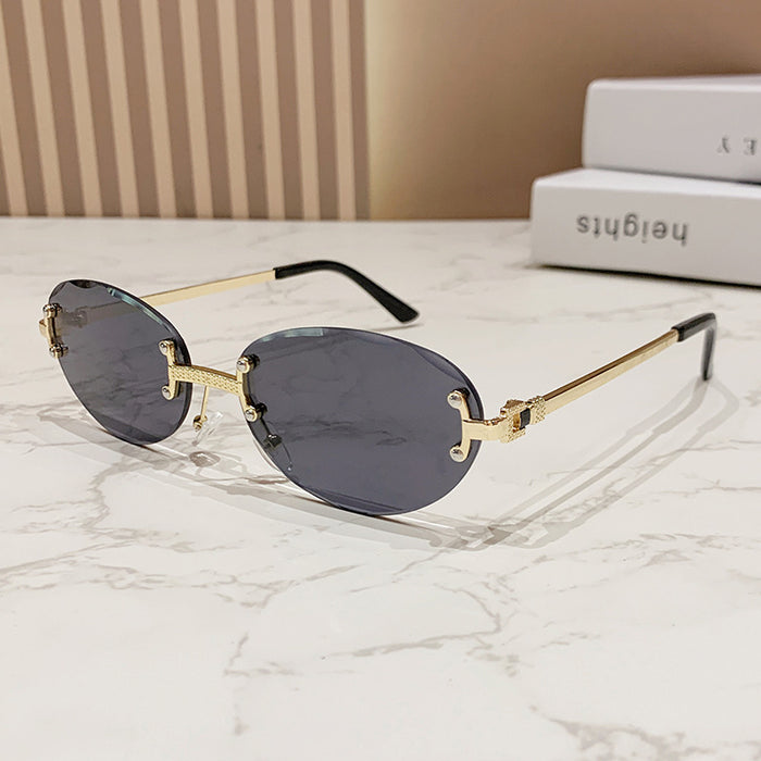 Wholesale Frameless cut sunglasses, fashionable oval frame glasses, gradient sunglasses