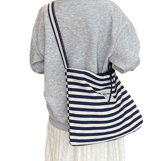 Wholesale New fashionable striped canvas bag with simple and large capacity letter printed double-sided crossbody bag, casual commuting shoulder bag