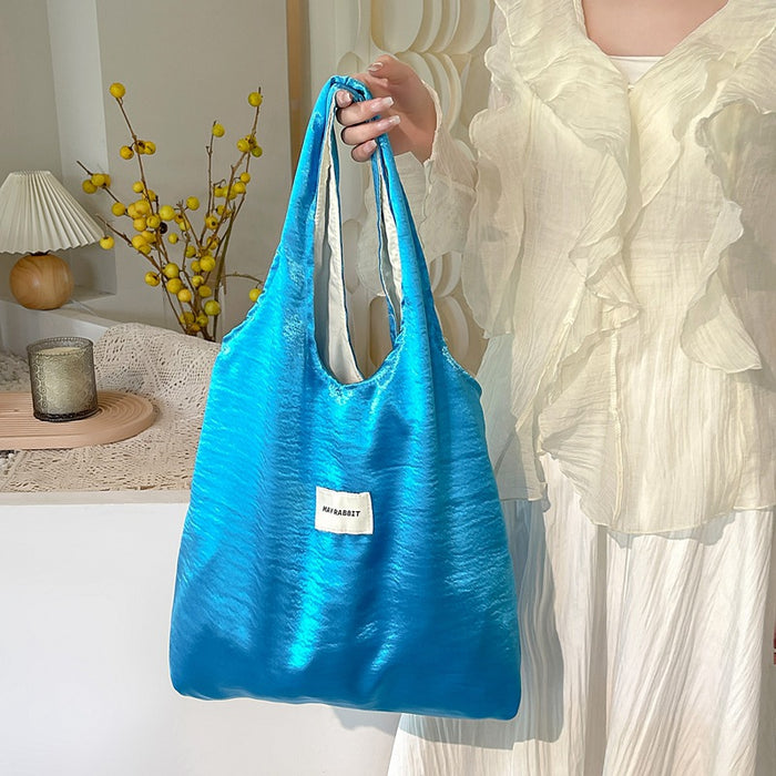 Wholesale Small niche design, environmentally friendly silver shoulder bag, large capacity leisure commuting shopping bag, handheld