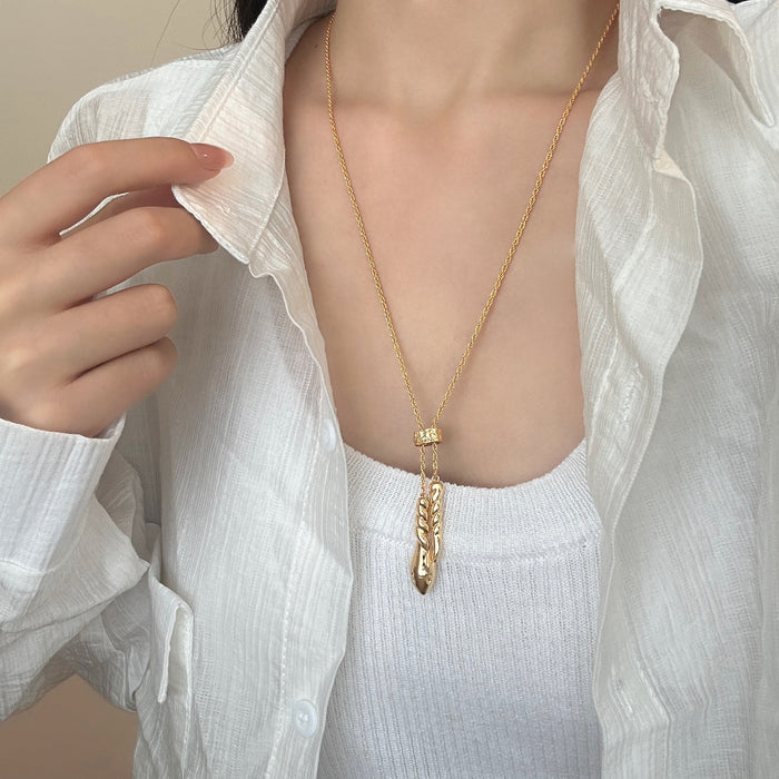 Wholesale Gold long drawable twisted necklace accessory, light luxury, niche, high-end, temperament pendant, sweater chain