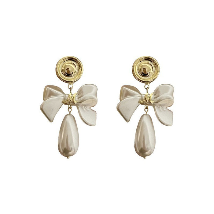 Wholesale Retro bow pearl earrings are fashionable, exquisite, versatile, and high-end geometric earrings and ear accessories