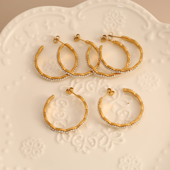 Wholesale Original design: Stainless steel earrings inlaid with pearls, personalized, luxurious, and high-end. Earrings with color preservation and electroplating wholesale