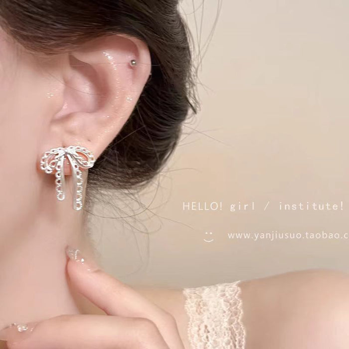 Wholesale Silver hollow bow earrings with a niche and high-end feel, designed earrings with a sense of sophistication