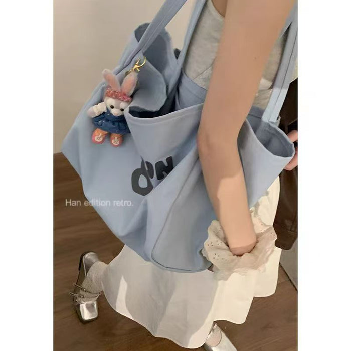 Wholesale Canvas bag commuting shoulder bag versatile tote bag large capacity outdoor tote bag