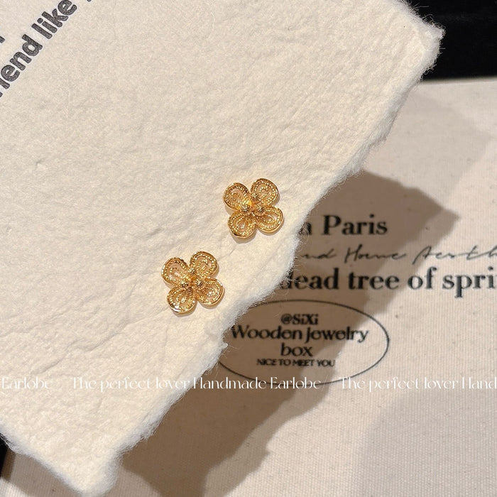 Wholesale Sand gold hollowed out exquisite flower earrings, niche temperament earrings, high-end and versatile earrings