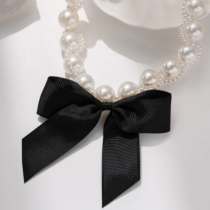Wholesale Retro exaggerated ribbon bow necklace with light luxury and high-end feel, imitation pearl collarbone chain necklace