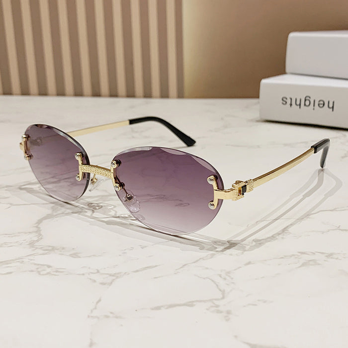 Wholesale Frameless cut sunglasses, fashionable oval frame glasses, gradient sunglasses