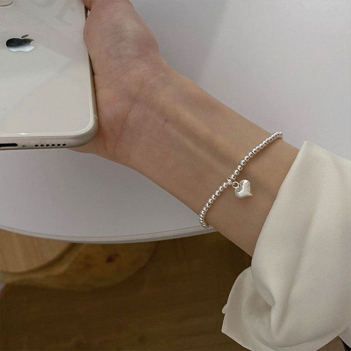 Wholesale Pure silver heart-shaped round bead bracelet with a new niche design, high-end feel, and light luxury bracelet accessories