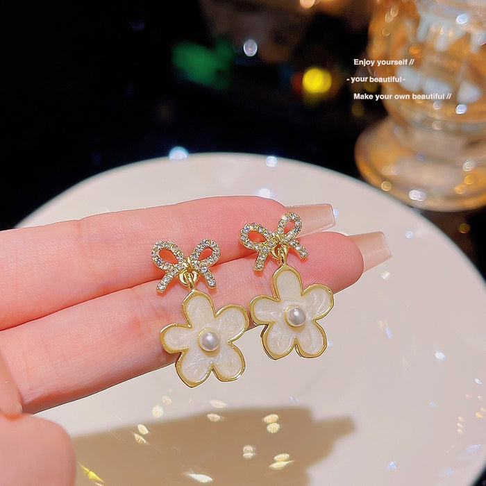 Wholesale Temperament bow flower pearl earrings fashion light luxury earrings niche feeling same style versatile earrings wholesale