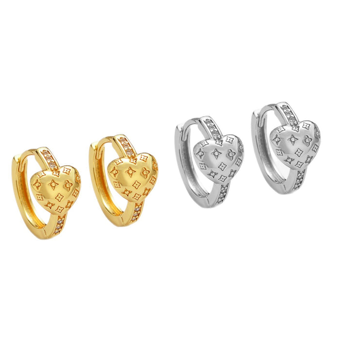 Wholesale Zirconia-studded heart-shaped metal earrings with a patterned design.
