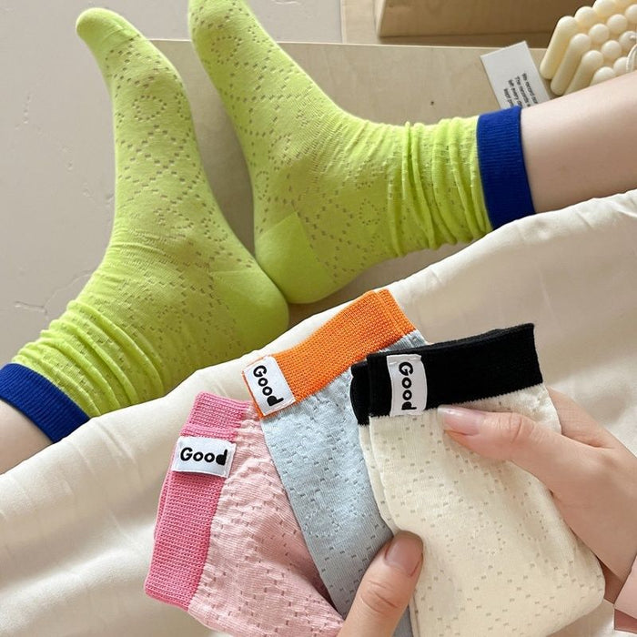 Wholesale Color blocked socks with hollowed out mesh and breathable lettering fabric label, colored midsole socks