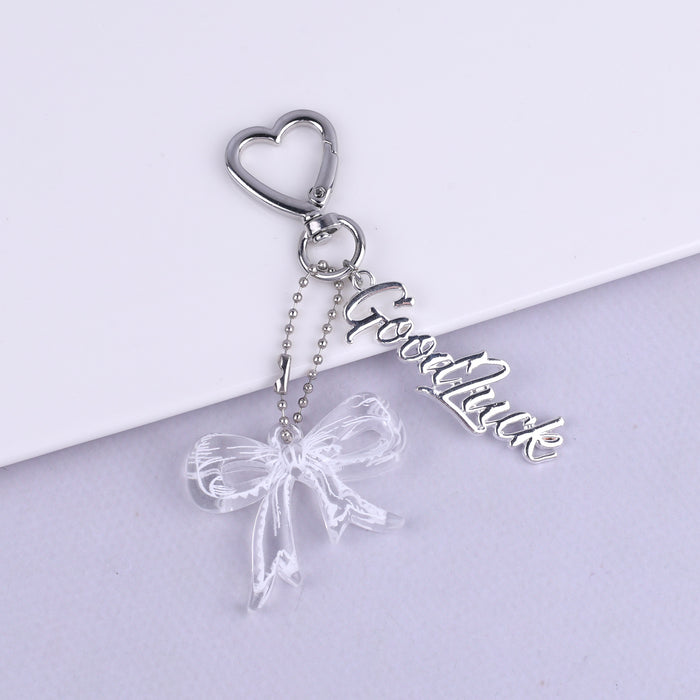 Wholesale Trendy black and white transparent bow acrylic heart keychain bag pendant personalized letter creative accessories