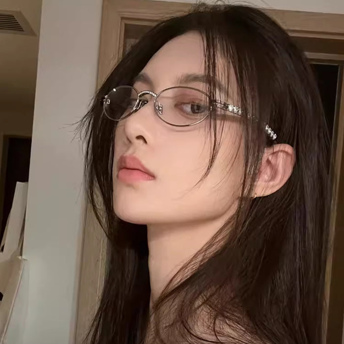 Wholesale Metallic silver small frame oval glasses with heart-shaped diamond inlay