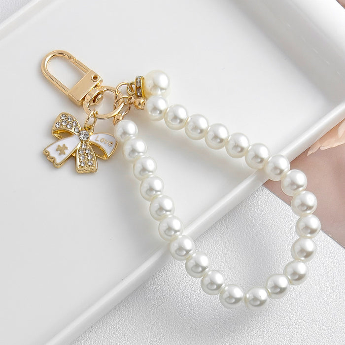 Wholesale Pearl chain beaded mobile phone lanyard bow pendant keychain