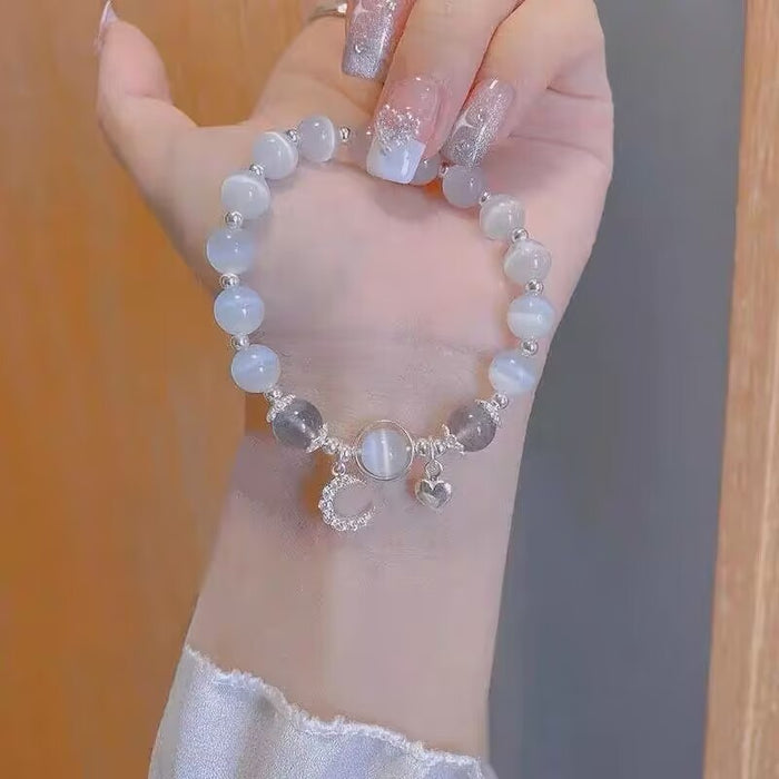 Wholesale Moonstone cat' s eye bracelet with bell pendant