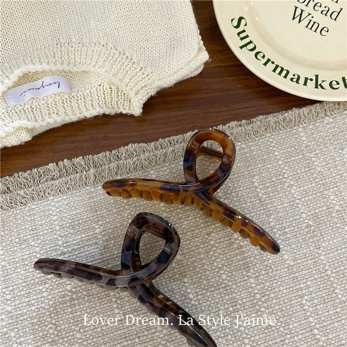 Wholesale Leopard print cross bow geometric hair clip, fashionable grip clip, versatile hair accessory