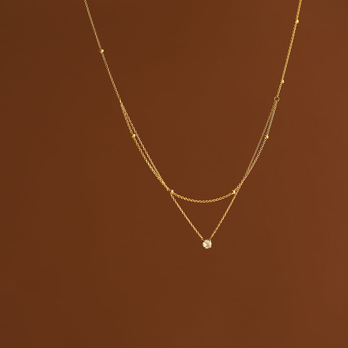 Wholesale Exquisite single diamond small double-layer necklace, gold bead collarbone chain, titanium steel electroplating