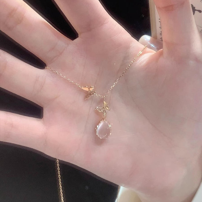 Wholesale Pure silver powder crystal droplet butterfly necklace for women, light luxury, niche, high-end design, collarbone chain