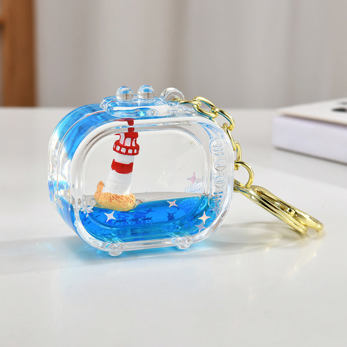 Wholesale Acrylic sailboat lighthouse blue oil-filled quicksand bottle keychain