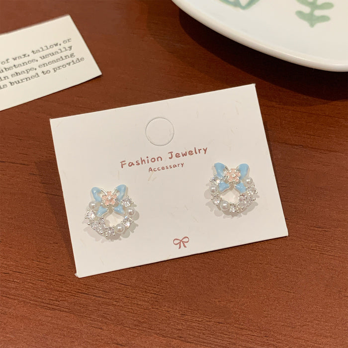 Wholesale Sweet and exquisite butterfly cherry blossom pearl earrings with silver needles, niche design, high-end and versatile earrings