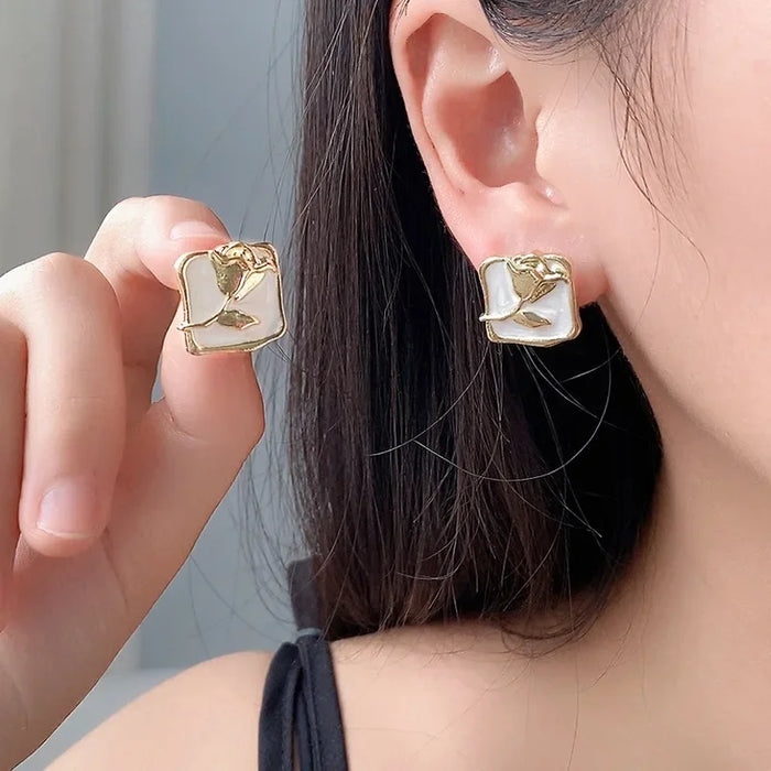 Wholesale Vintage rose silver needle earrings autumn and winter new item niche painting oil rose flower wholesale