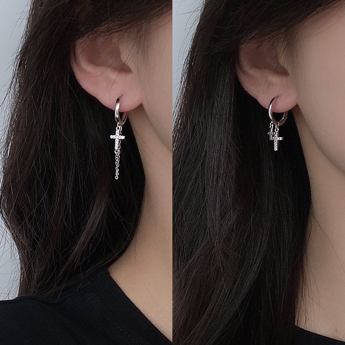 Wholesale Double layered cross studded diamond earrings with neutral tassels and asymmetrical cross shaped ear loops