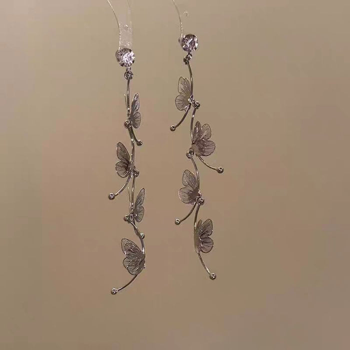 Wholesale Sparkling diamond dynamic hollow butterfly tassel earrings, light luxury temperament, high-end feeling, niche earrings, exaggerated earrings