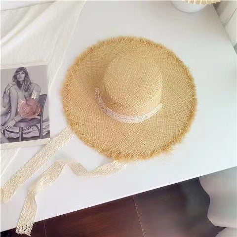 Wholesale Big brim frayed Lafite grass hat women's beach hat for beach vacation, sun protection and sunshade hat