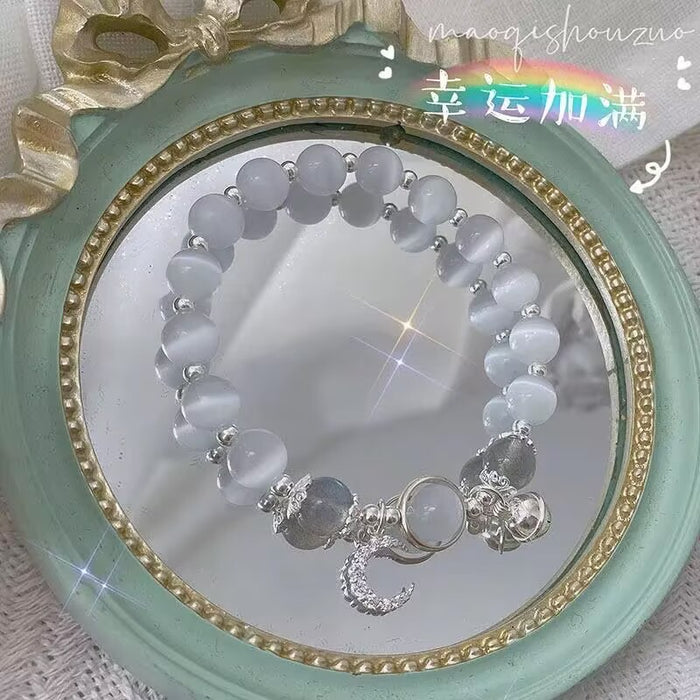 Wholesale Moonstone cat' s eye bracelet with bell pendant
