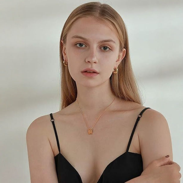 Wholesale Copper plated genuine gold earrings with fashionable and high-end photosensitive surface