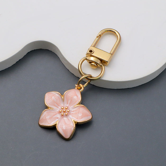 Wholesale Simple Dropping Oil Cherry Blossom Pendant Keychain Alloy Daisy Flower