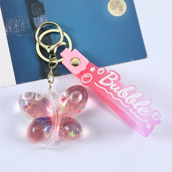 Wholesale Acrylic oil butterfly quicksand keychain bag pendant candy color